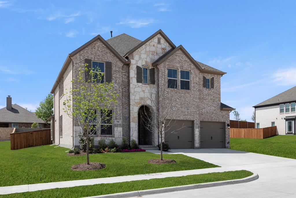 708 Splendor Drive McKinney, TX 75072 - Photo 2 of 29 a front view of a house with a yard