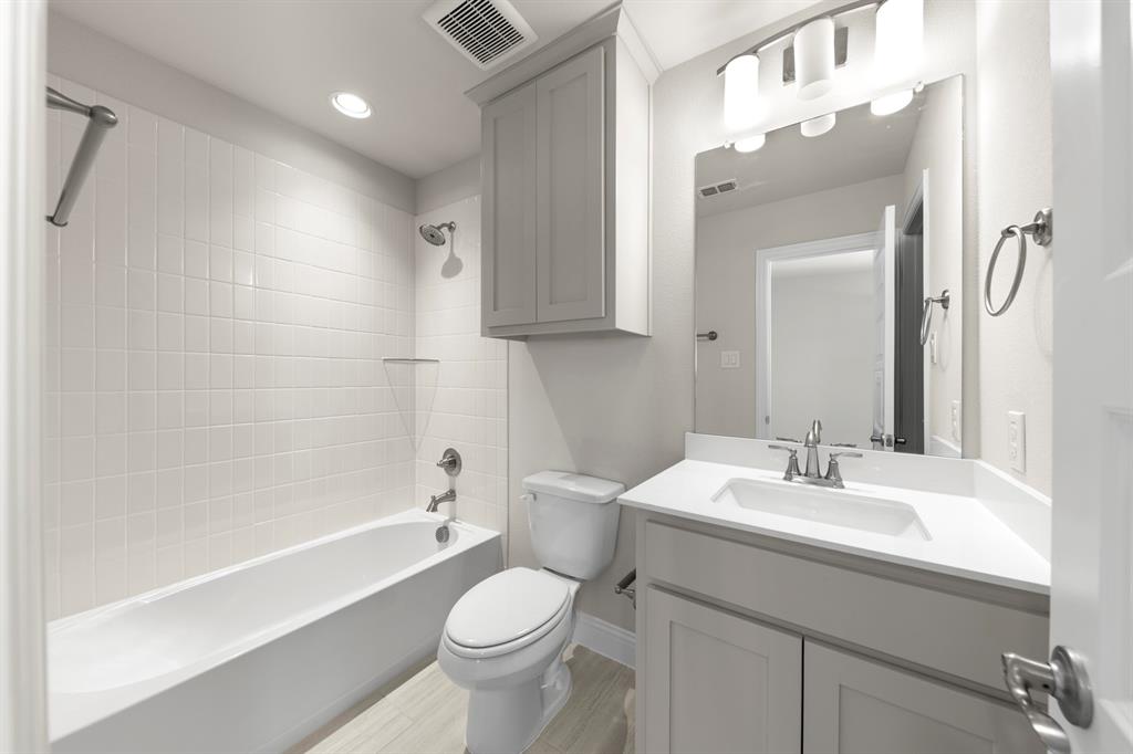 708 Splendor Drive McKinney, TX 75072 - Photo 24 of 29 a bathroom with a sink a toilet and shower