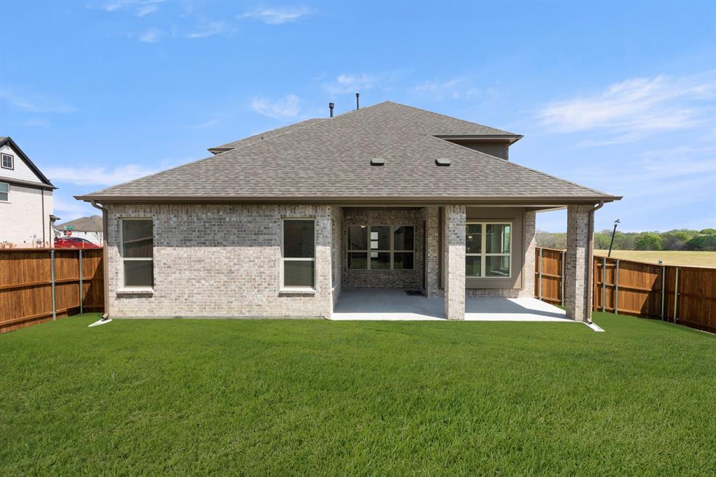 708 Splendor Drive McKinney, TX 75072 - Photo 26 of 29 a front view of a house with a yard and porch