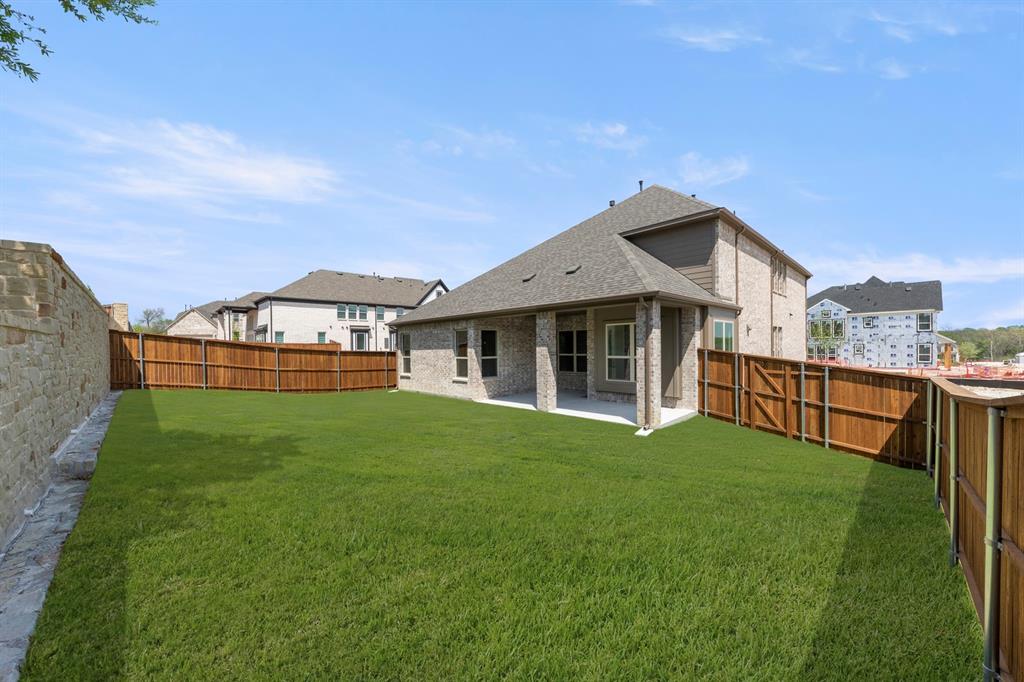 708 Splendor Drive McKinney, TX 75072 - Photo 27 of 29 a front view of a house with a yard and porch