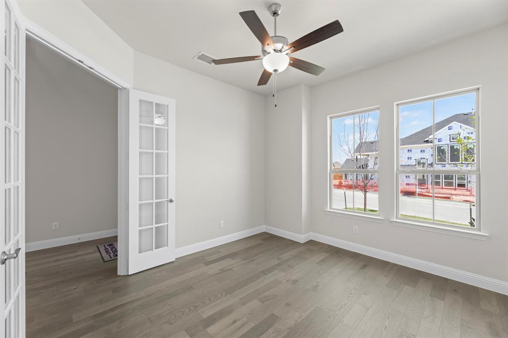 708 Splendor Drive McKinney, TX 75072 - Photo 4 of 29 wooden floor in an empty room with a window