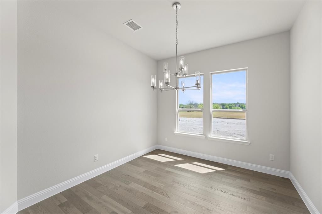 708 Splendor Drive McKinney, TX 75072 - Photo 5 of 29 a view of an empty room with a window