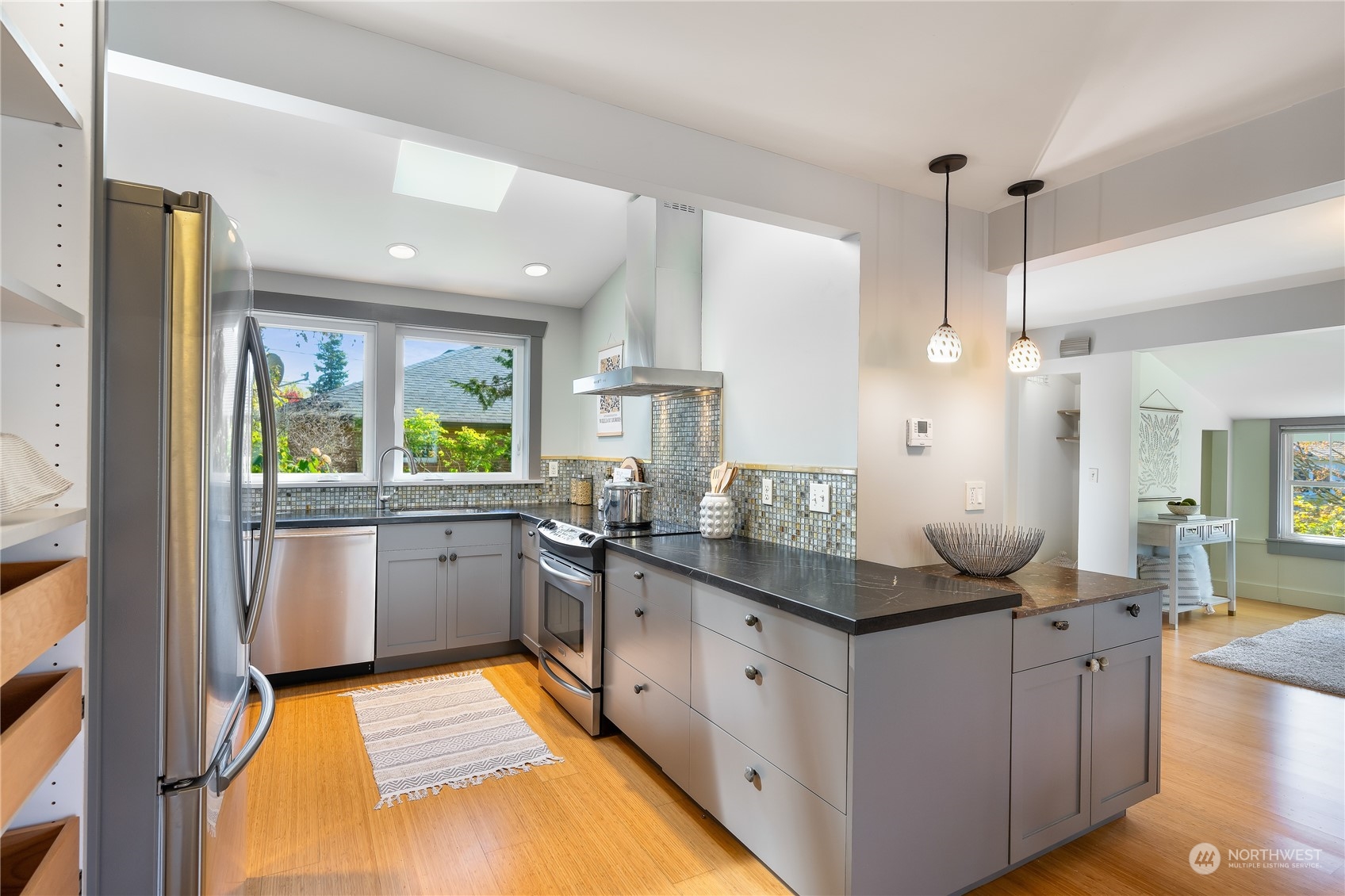 1408 Northwest 73rd Street Seattle, WA 98117 - Photo 16 of 40 a kitchen with counter top space sink and stove