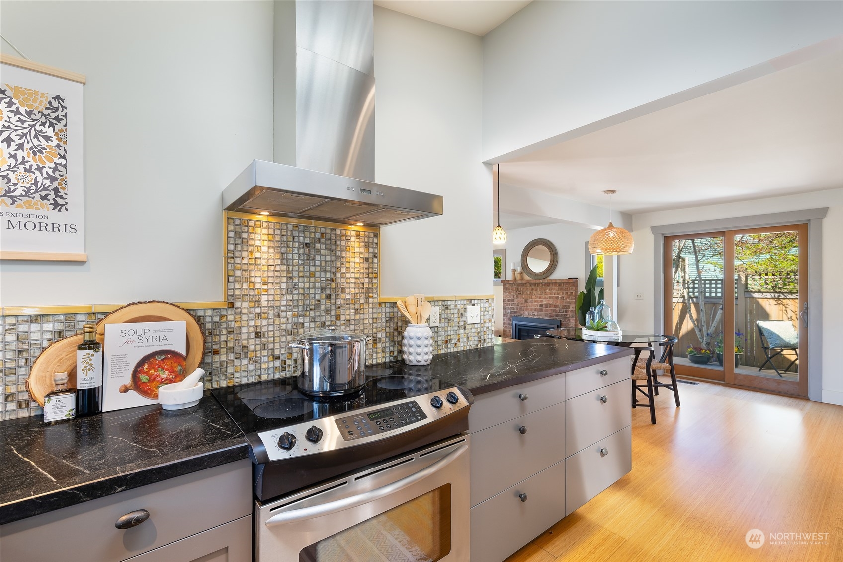 1408 Northwest 73rd Street Seattle, WA 98117 - Photo 17 of 40 a kitchen with stainless steel appliances granite countertop a stove and a sink