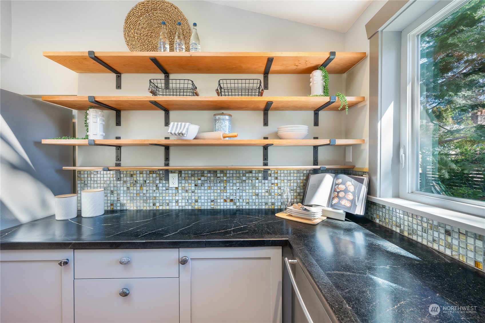 1408 Northwest 73rd Street Seattle, WA 98117 - Photo 18 of 40 a kitchen with a sink a counter space and cabinets