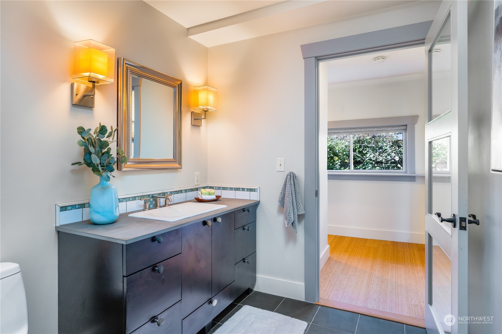 1408 Northwest 73rd Street Seattle, WA 98117 - Photo 24 of 40 a bathroom with a sink and a mirror