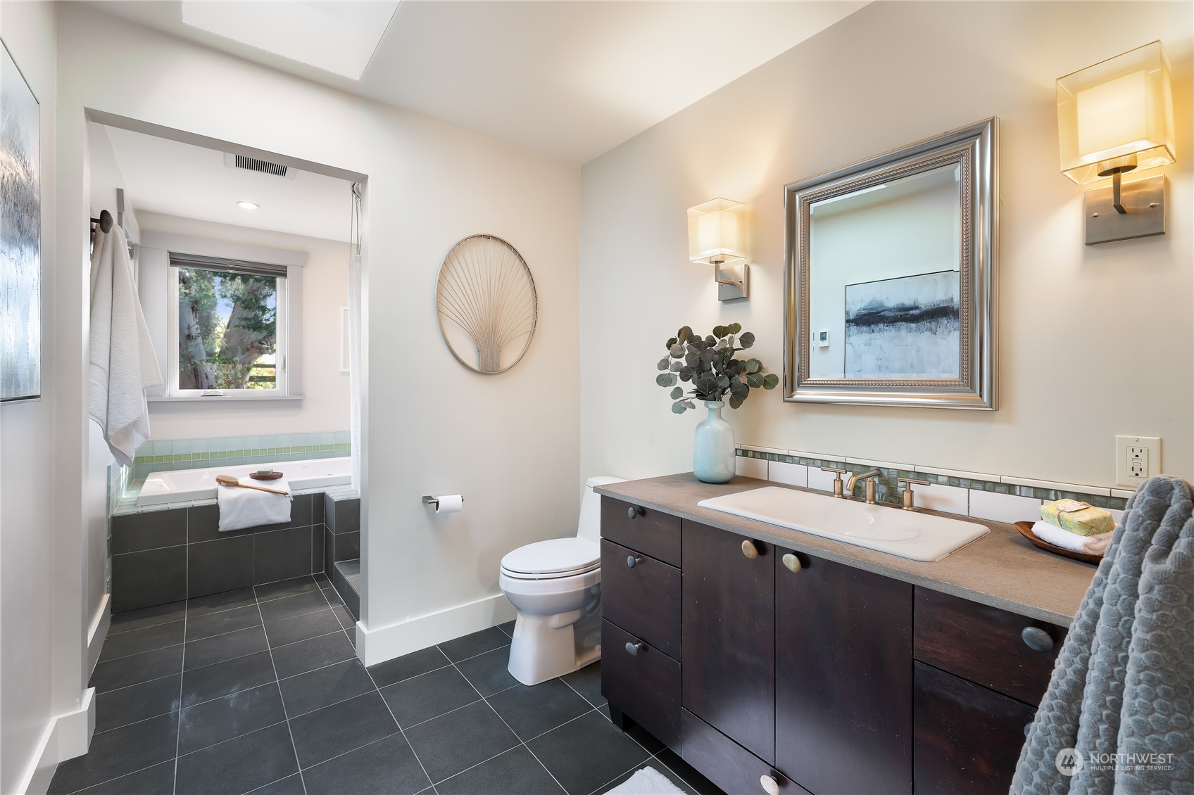 1408 Northwest 73rd Street Seattle, WA 98117 - Photo 25 of 40 a bathroom with a toilet sink and mirror