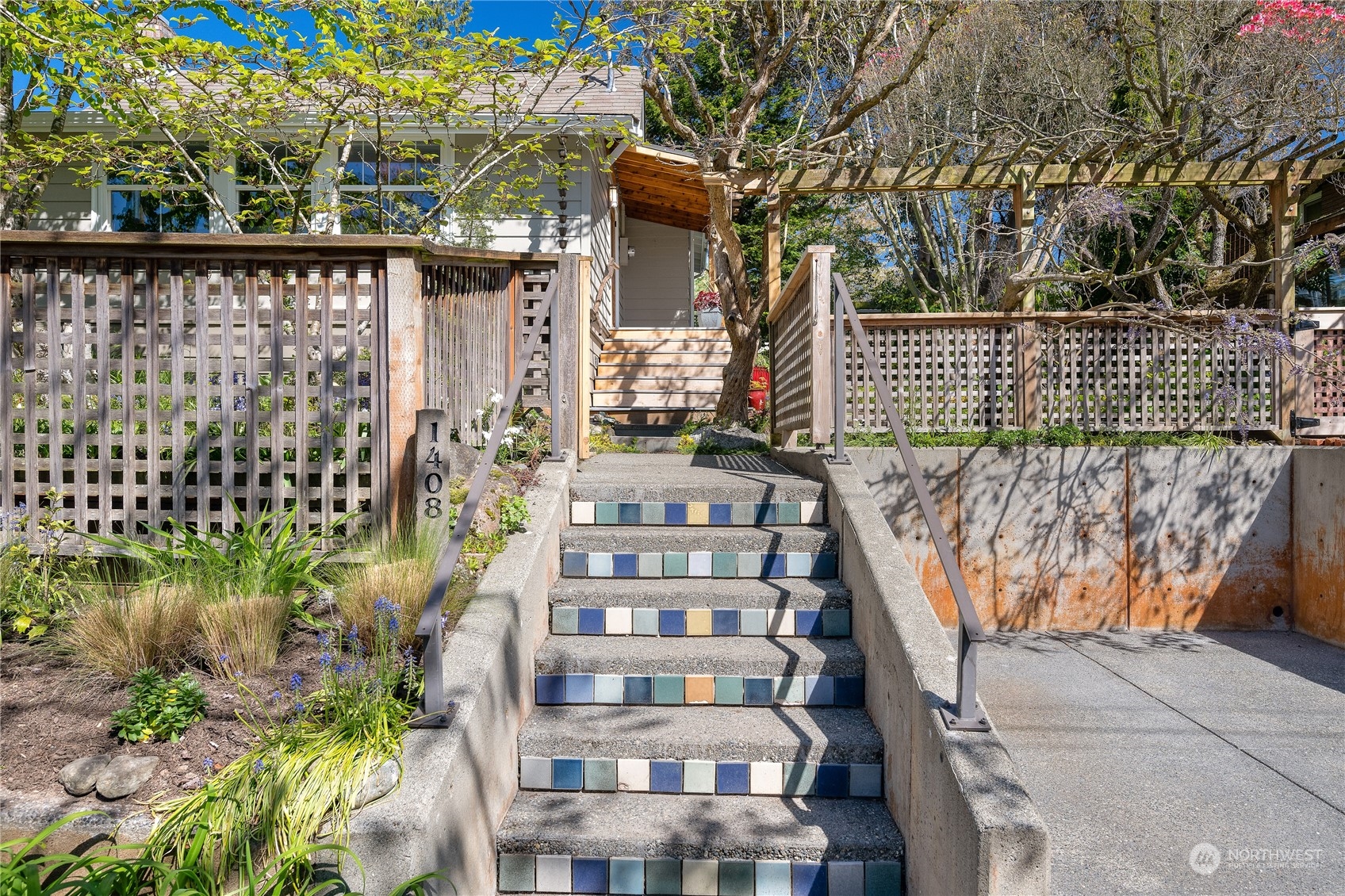 1408 Northwest 73rd Street Seattle, WA 98117 - Photo 37 of 40 a front view of a house with a garden