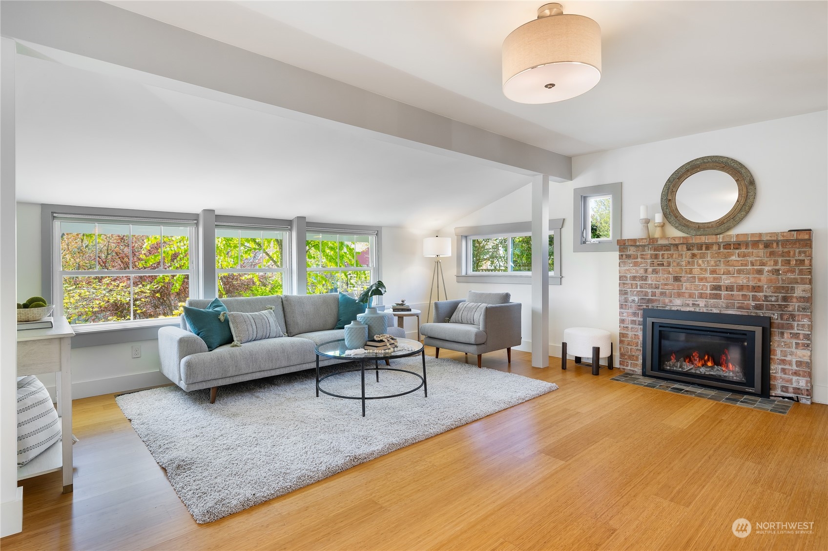 1408 Northwest 73rd Street Seattle, WA 98117 - Photo 4 of 40 a living room with furniture and a fireplace