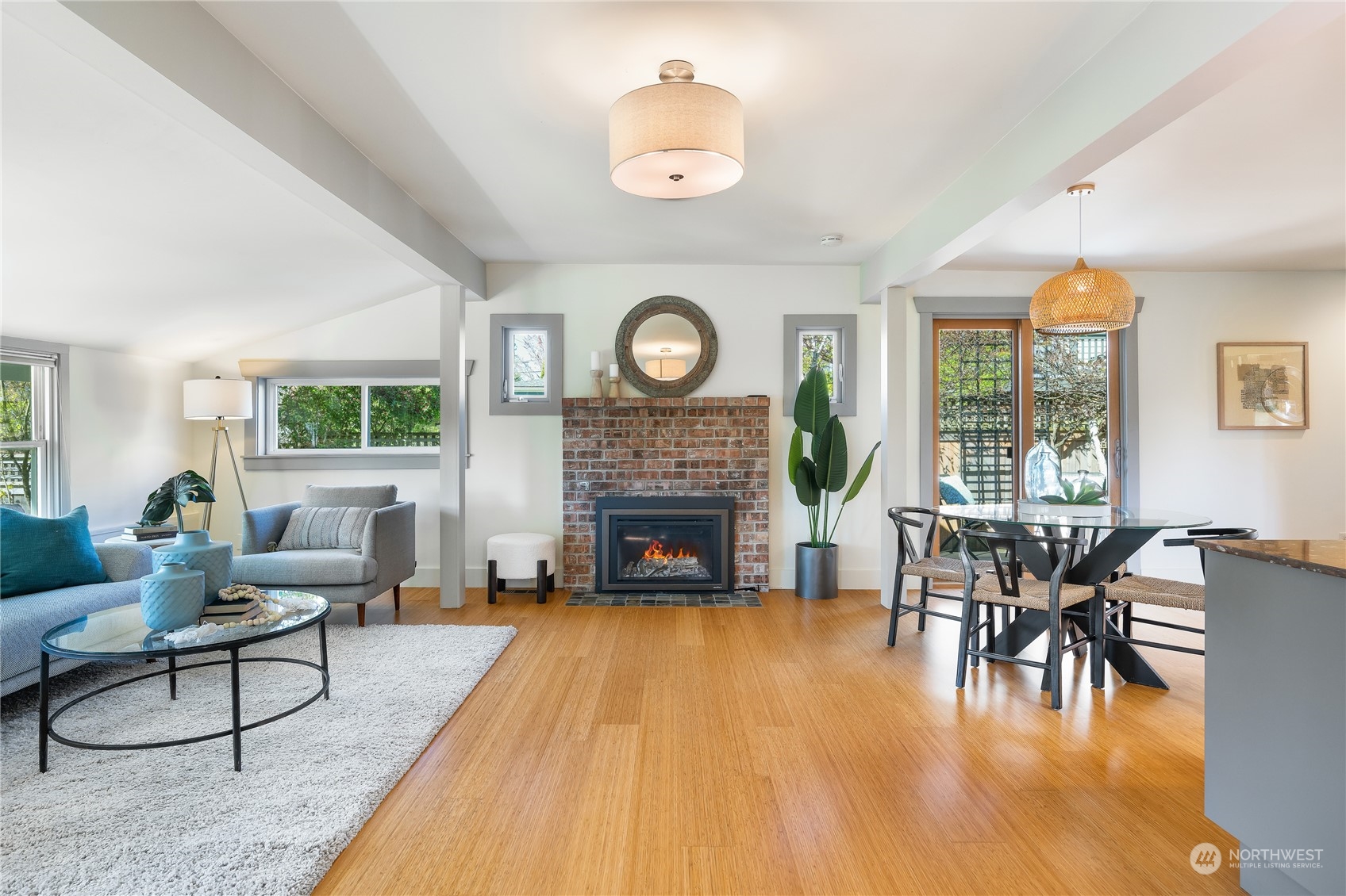 1408 Northwest 73rd Street Seattle, WA 98117 - Photo 5 of 40 a living room with furniture a fireplace and a large window