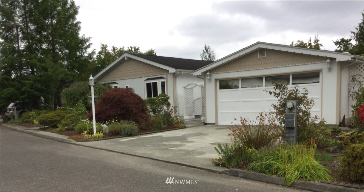 23710 9th Place West Bothell, WA 98021 - Photo 1 of 1 a view of a house with a small yard and plants