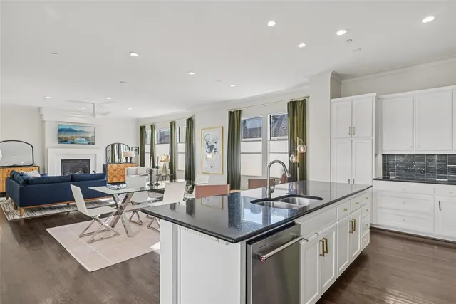 a view of a porch with table and chairs potted plants