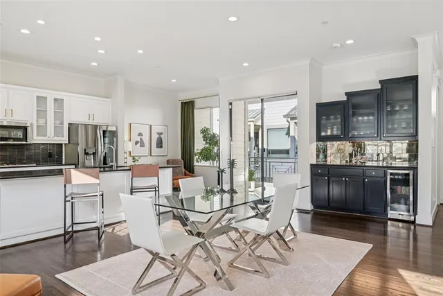 a living room with stainless steel appliances kitchen island granite countertop furniture and a kitchen view