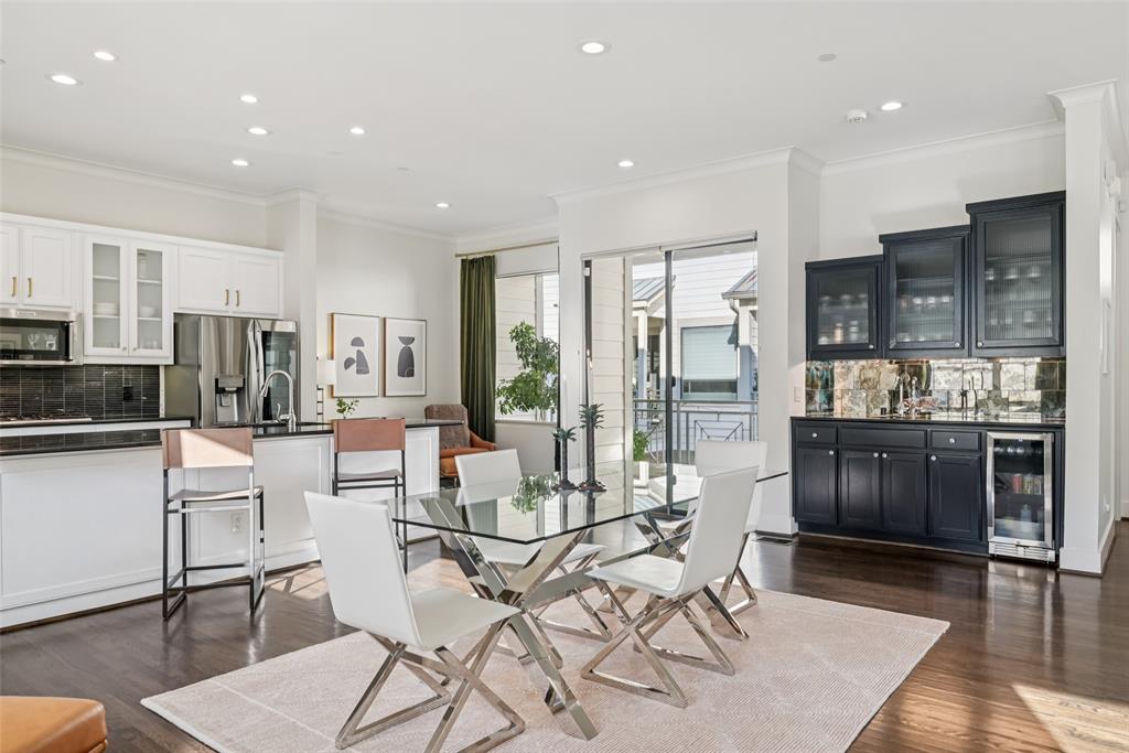 3926 Holland Avenue, Unit 102 Dallas, TX 75219 - Photo 2 of 40 a living room with stainless steel appliances kitchen island granite countertop furniture and a kitchen view