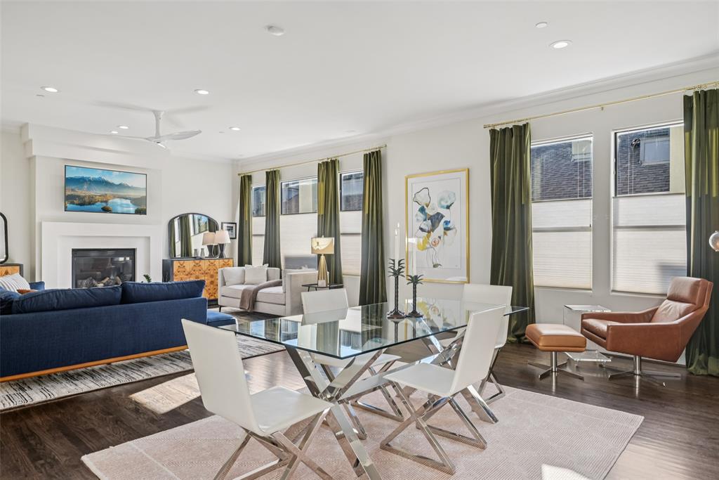 3926 Holland Avenue, Unit 102 Dallas, TX 75219 - Photo 20 of 40 a living room with fireplace furniture and a large window