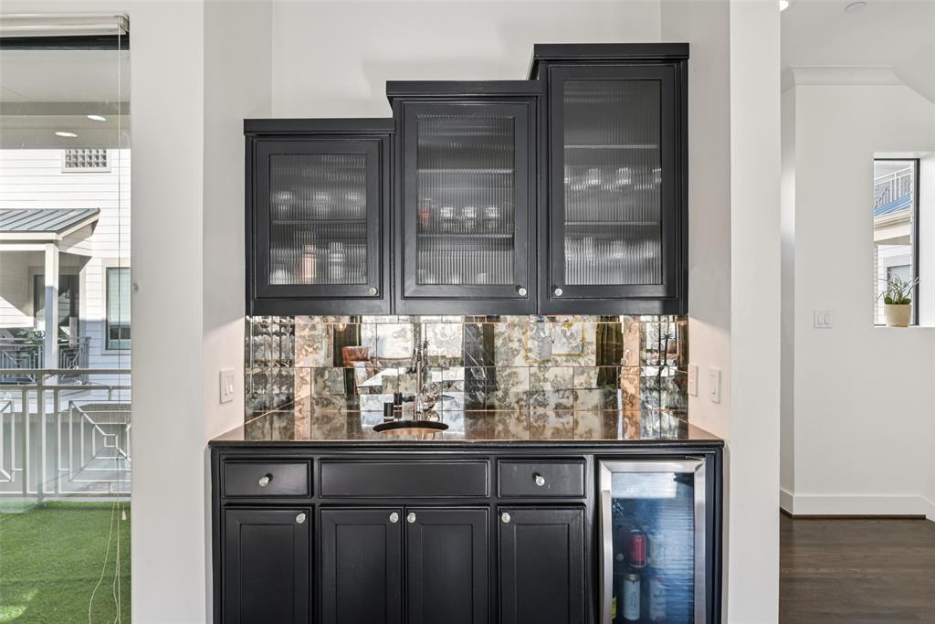 3926 Holland Avenue, Unit 102 Dallas, TX 75219 - Photo 21 of 40 a kitchen with a sink and cabinets