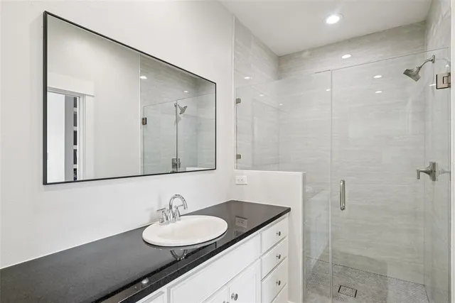 a bedroom with a large bed and a large window