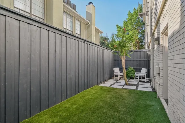 a bedroom with a large bed and a large window