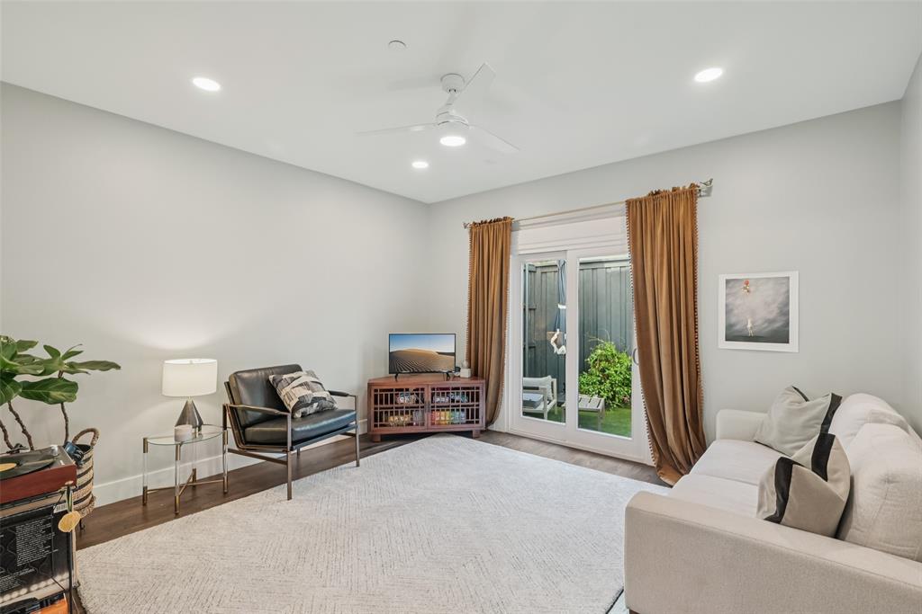 3926 Holland Avenue, Unit 102 Dallas, TX 75219 - Photo 9 of 40 a living room with furniture and a large window