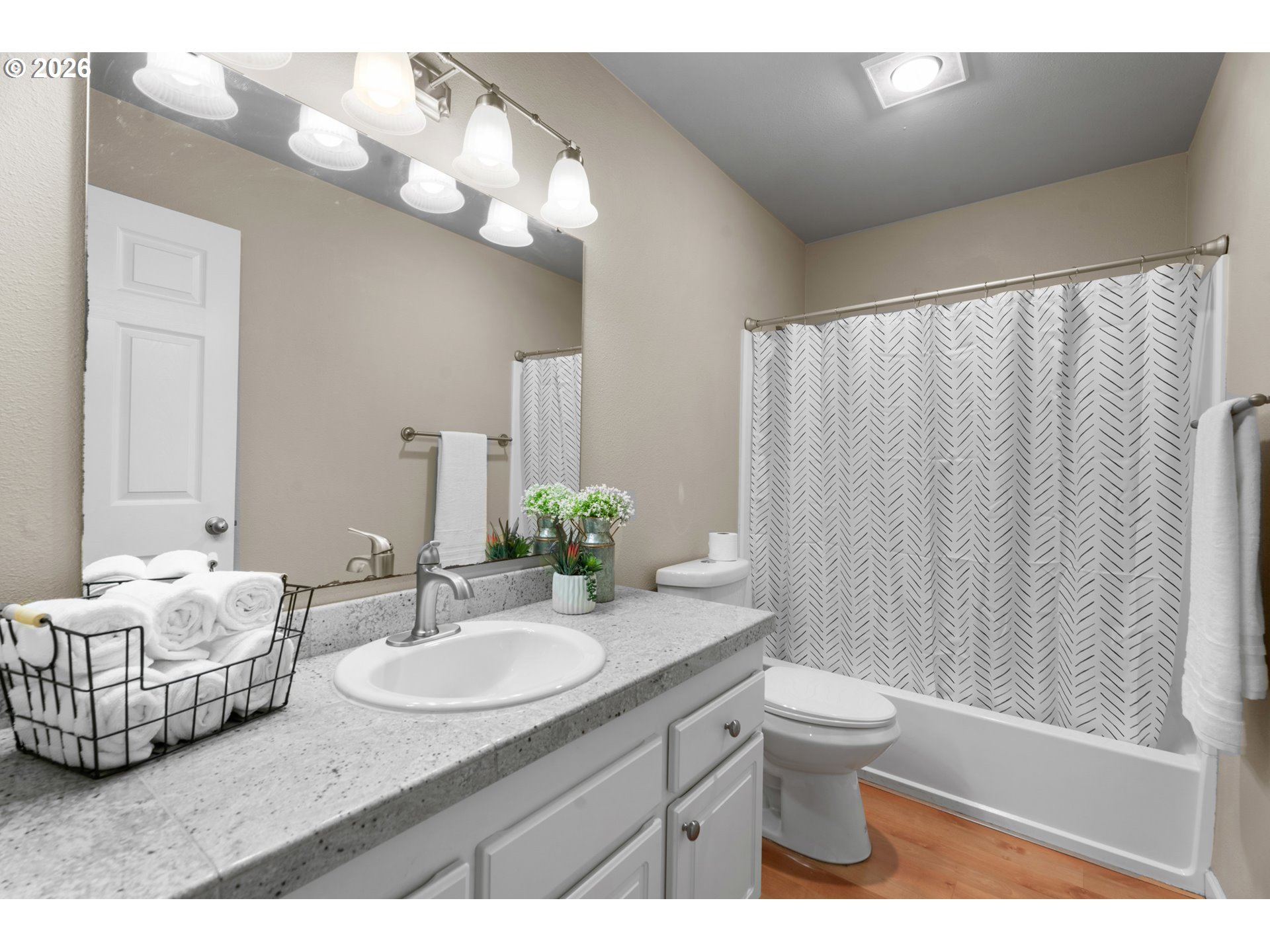 10178 Southeast Talbert Street Clackamas, OR 97015 - Photo 13 of 27 a bathroom with a granite countertop sink mirror and toilet