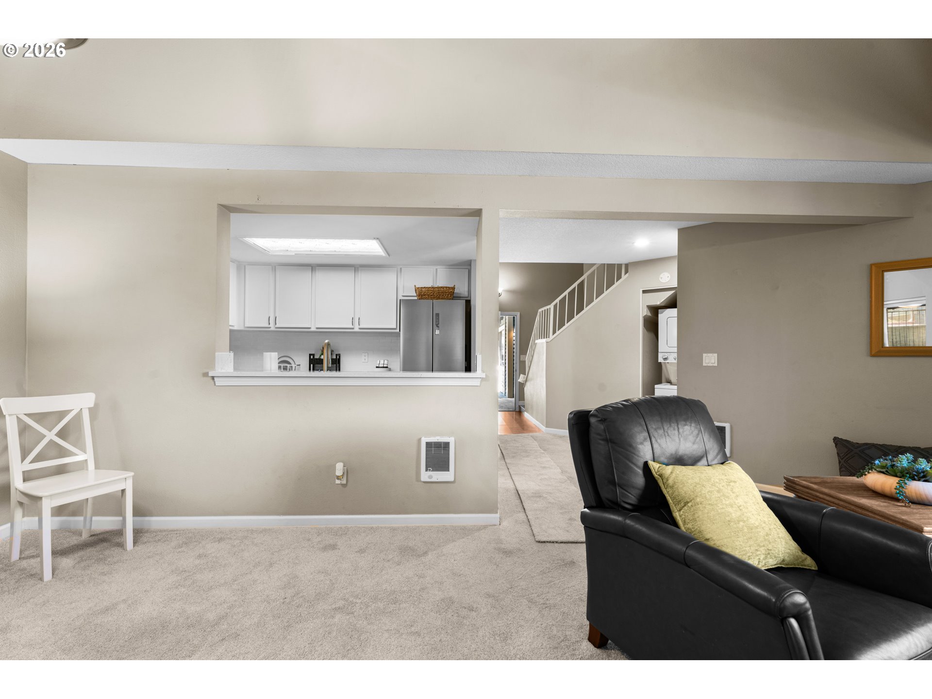 10178 Southeast Talbert Street Clackamas, OR 97015 - Photo 5 of 27 a living room with a couch and a potted plant