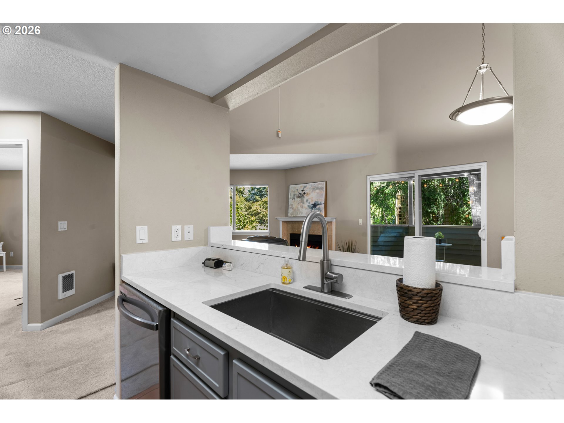 10178 Southeast Talbert Street Clackamas, OR 97015 - Photo 8 of 27 a kitchen with a sink dishwasher and a stove with wooden floor