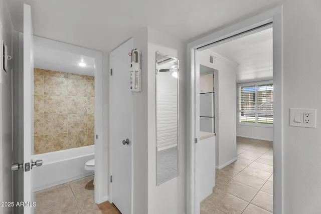 an empty room with mirror