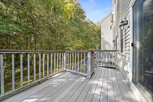 a view of balcony with wooden floor