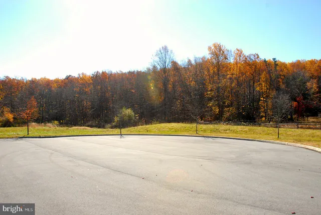 a view of a swimming pool with an outdoor space and seating area