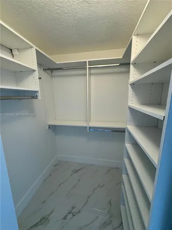a view of an empty walk in closet
