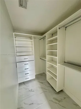 a view of an empty walk in closet