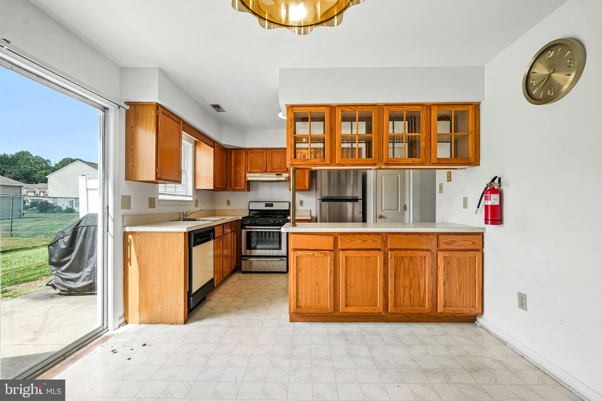 2002 Tall Pines Pine Hill, NJ 08021 - Photo 13 of 31 a kitchen with stainless steel appliances granite countertop a stove a sink and a refrigerator