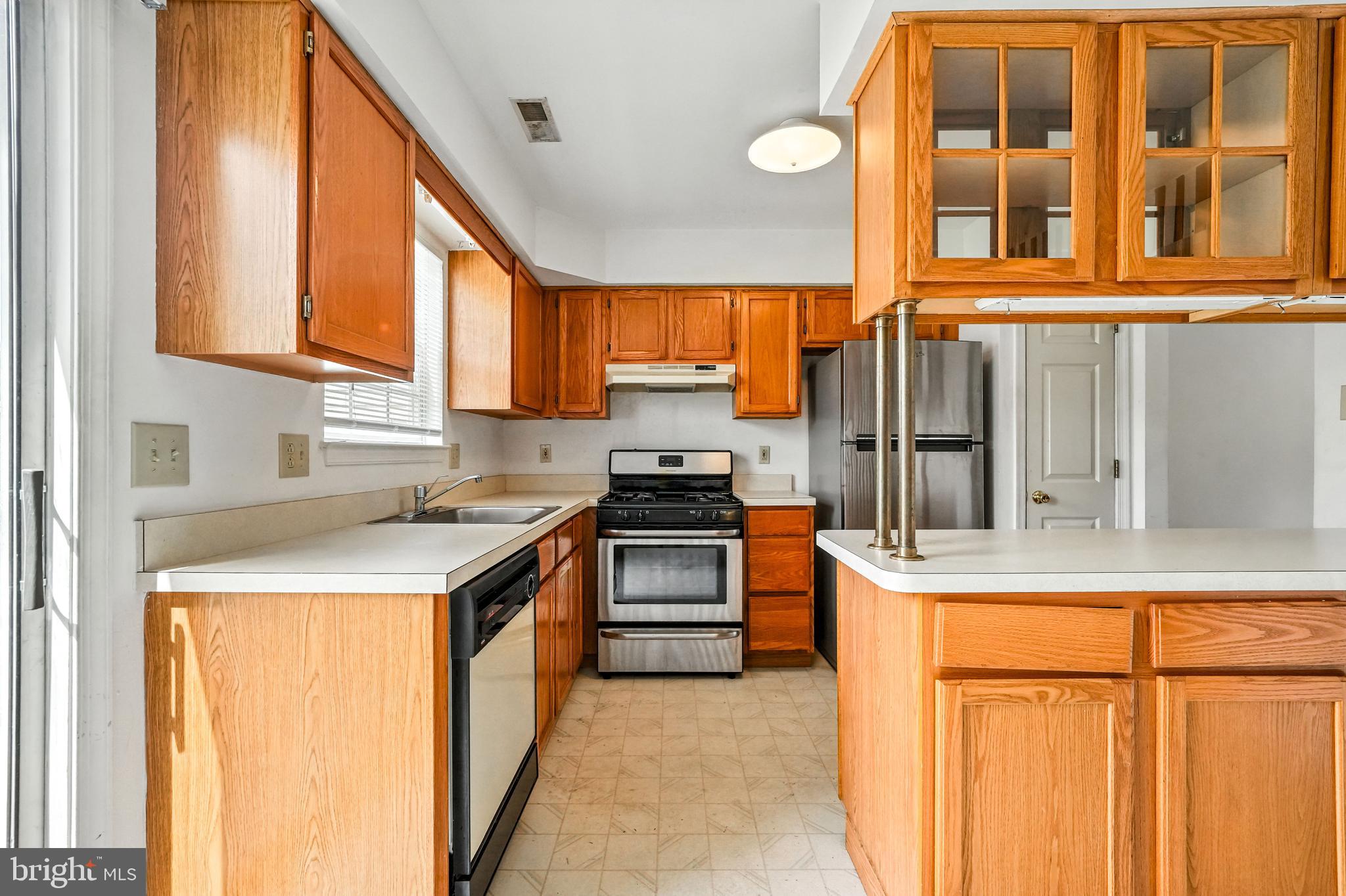 2002 Tall Pines Pine Hill, NJ 08021 - Photo 14 of 31 a kitchen with stainless steel appliances granite countertop a stove and a refrigerator