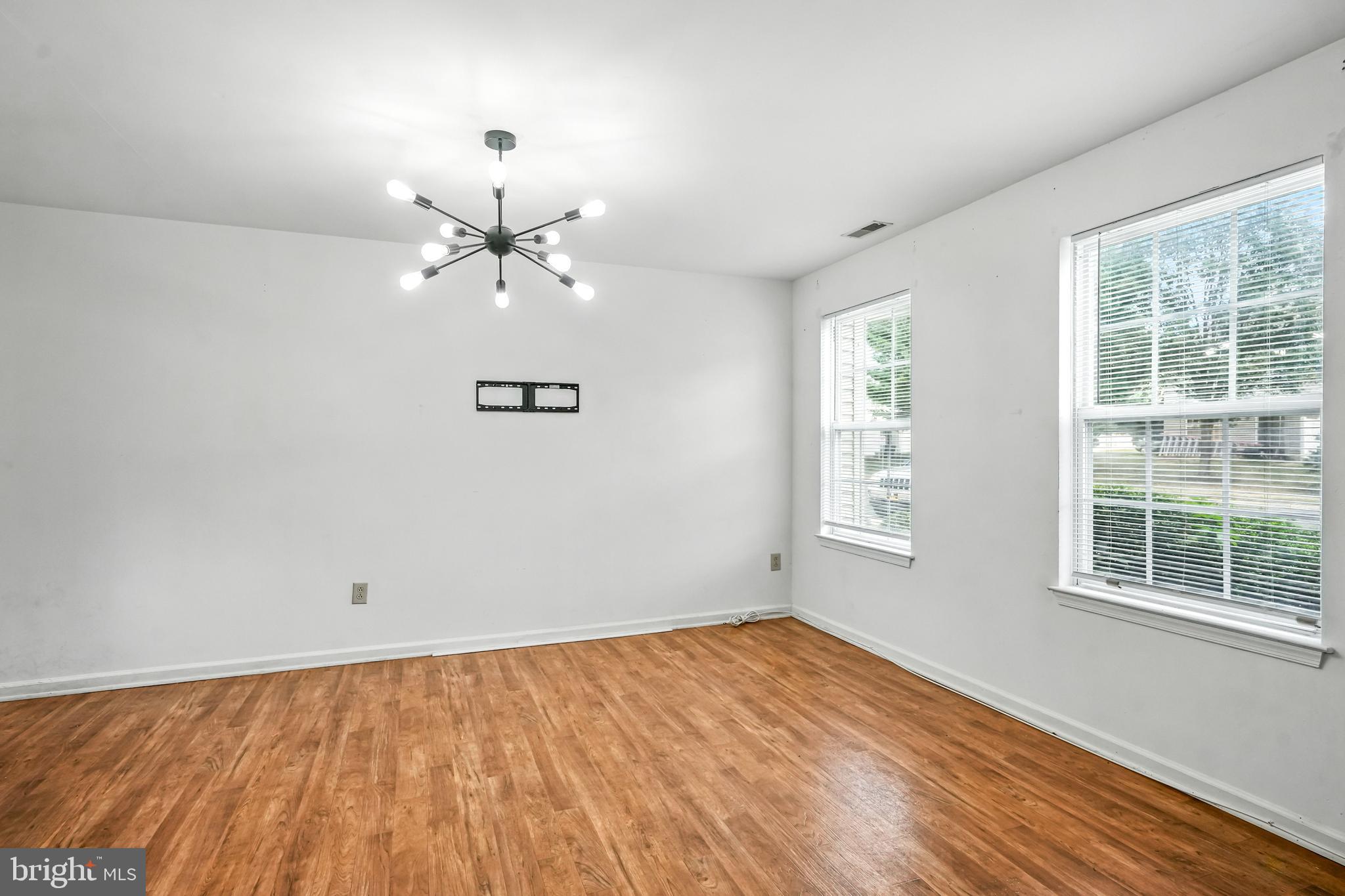 2002 Tall Pines Pine Hill, NJ 08021 - Photo 5 of 31 wooden floor in an empty room with a window