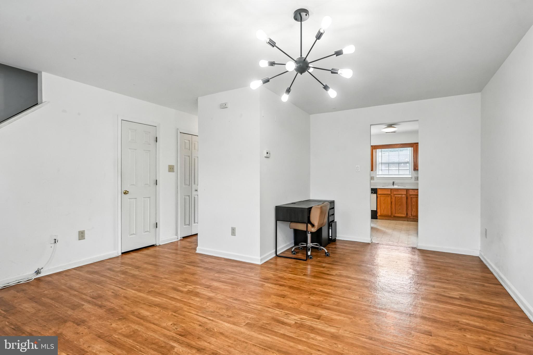 2002 Tall Pines Pine Hill, NJ 08021 - Photo 7 of 31 a view of empty room with wooden floor and fan