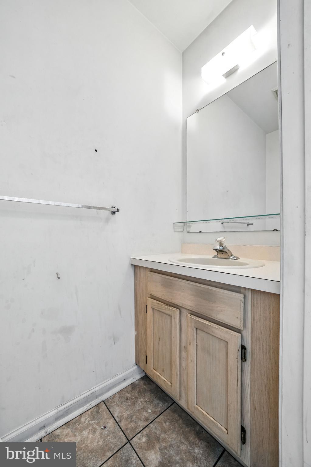 2002 Tall Pines Pine Hill, NJ 08021 - Photo 10 of 31 a bathroom with a sink and a mirror
