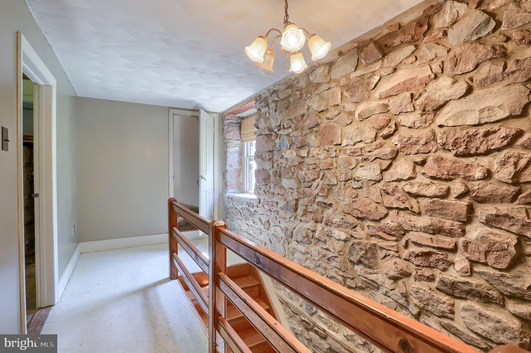 1252 Cocalico Road Birdsboro, PA 19508 - Photo 23 of 66 hallway exposed stone