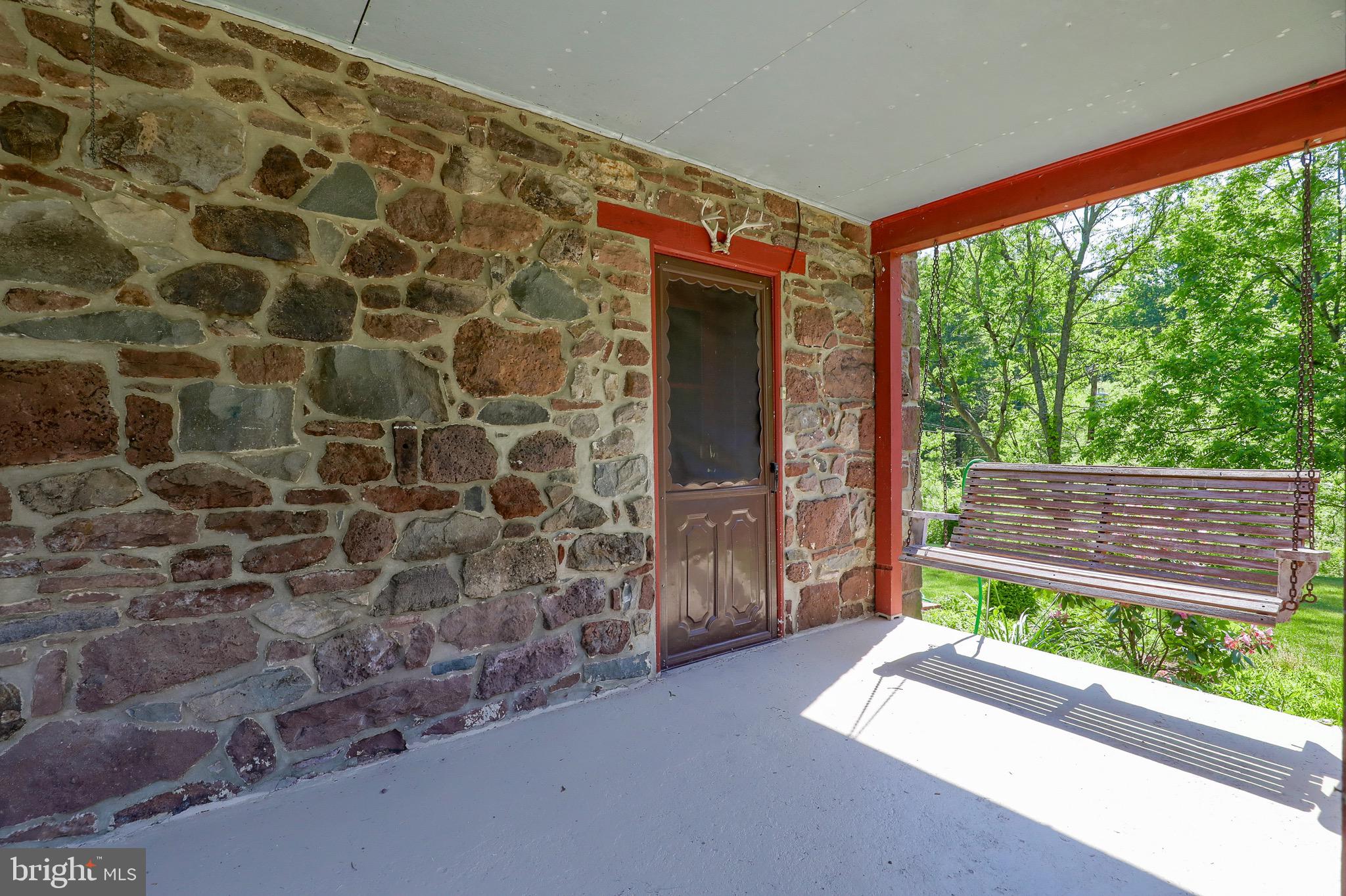 1252 Cocalico Road Birdsboro, PA 19508 - Photo 6 of 66 Side porch and swing