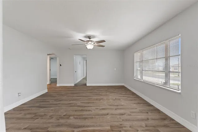 a view of an empty room with a window