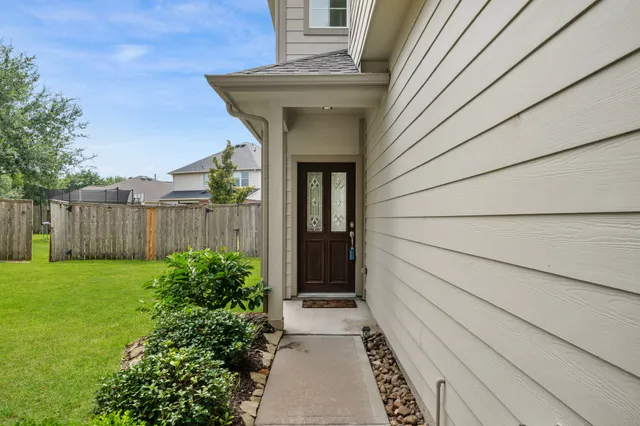 a view of a pathway besides a house
