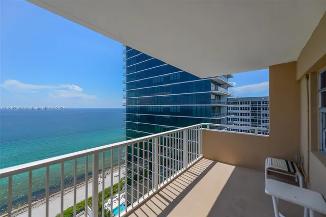 a view of balcony with wooden floor and windows