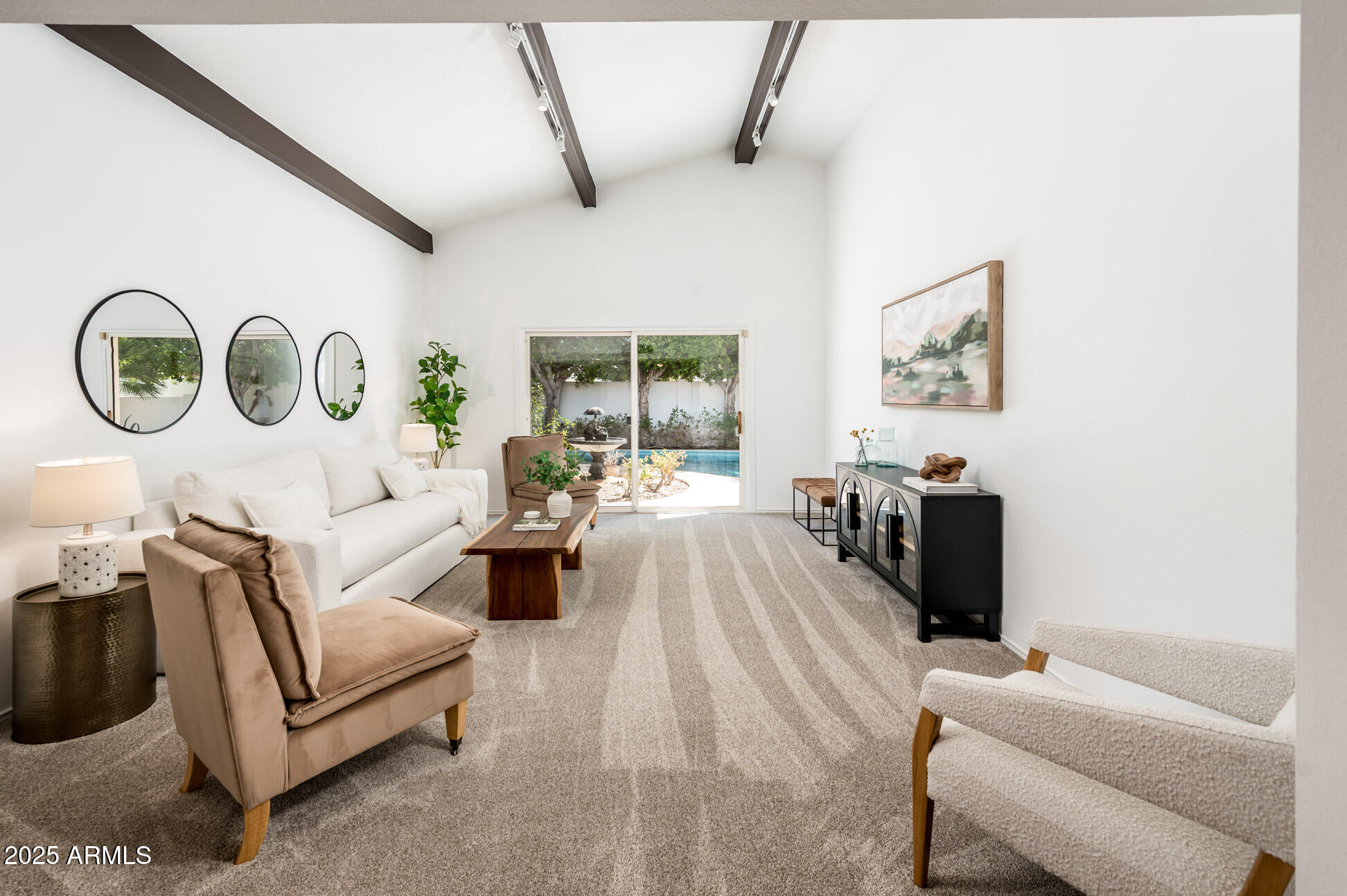 1224 East Rancho Drive Phoenix, AZ 85014 - Photo 1 of 38 a living room with furniture and a large window