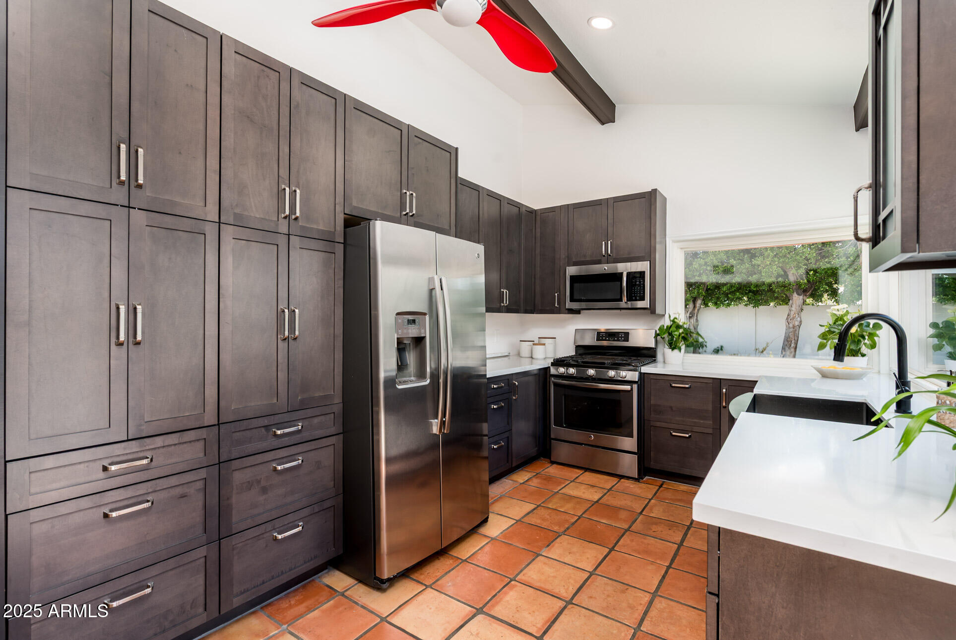 1224 East Rancho Drive Phoenix, AZ 85014 - Photo 17 of 38 a kitchen with stainless steel appliances granite countertop a refrigerator stove and oven