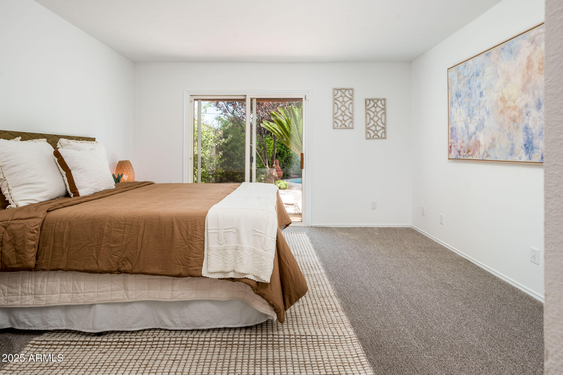 1224 East Rancho Drive Phoenix, AZ 85014 - Photo 20 of 38 a bedroom with a large bed and a window