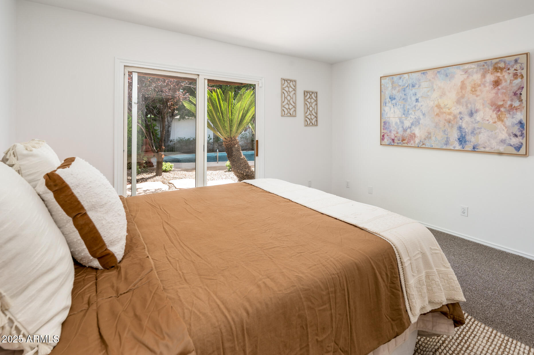 1224 East Rancho Drive Phoenix, AZ 85014 - Photo 21 of 38 a bedroom with a bed and wooden floor