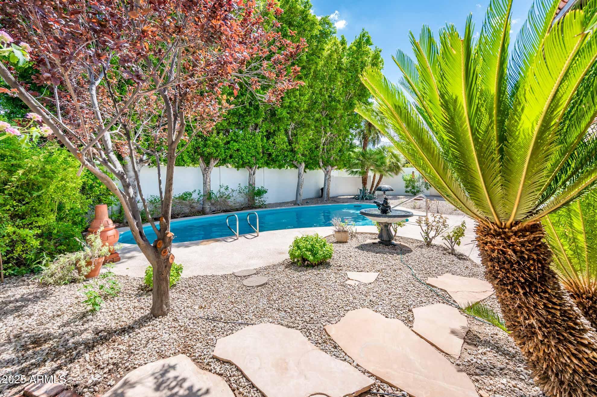 1224 East Rancho Drive Phoenix, AZ 85014 - Photo 22 of 38 a backyard of a house with table and chairs