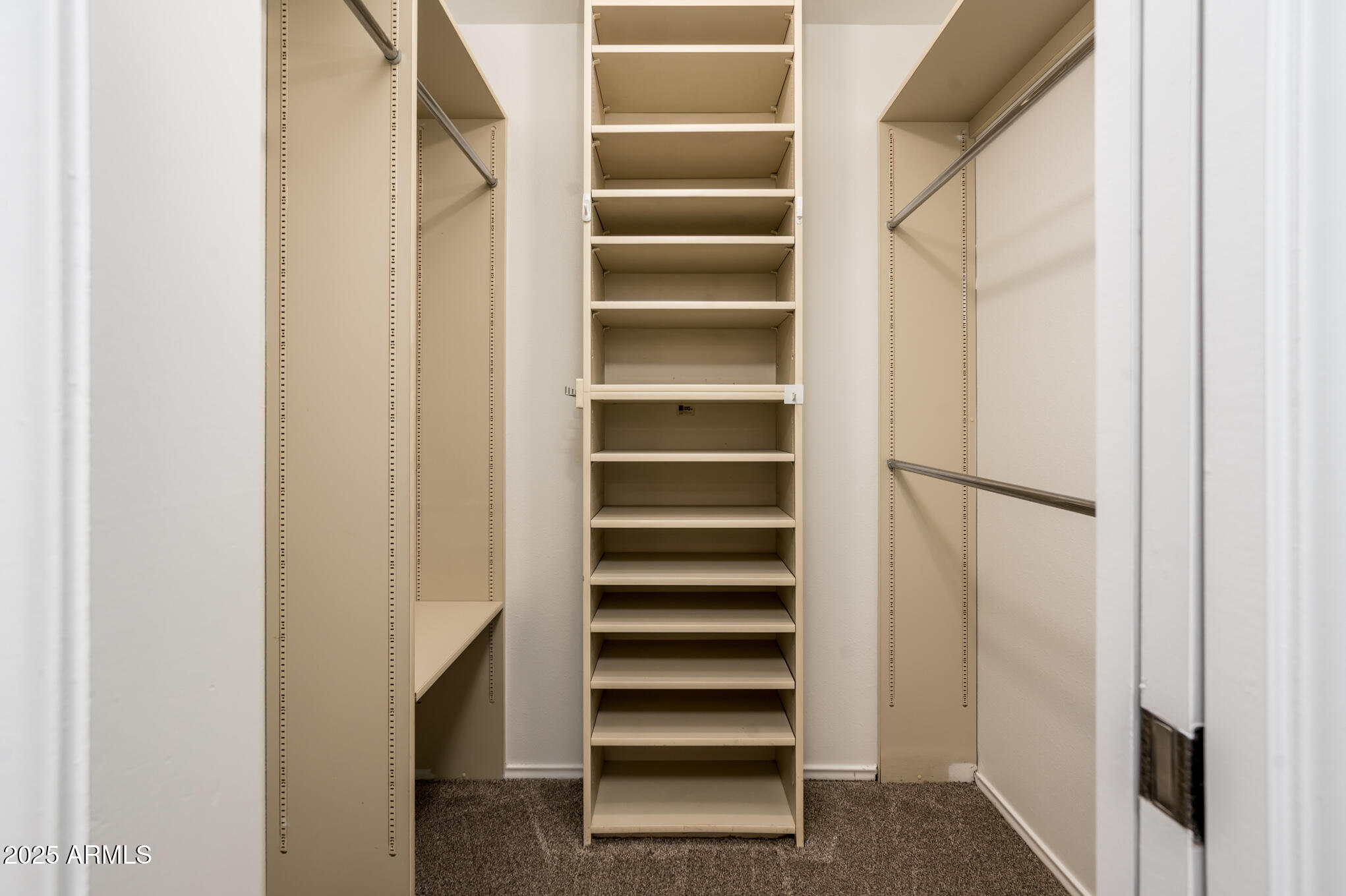 1224 East Rancho Drive Phoenix, AZ 85014 - Photo 25 of 38 a view of walk in closet with empty racks