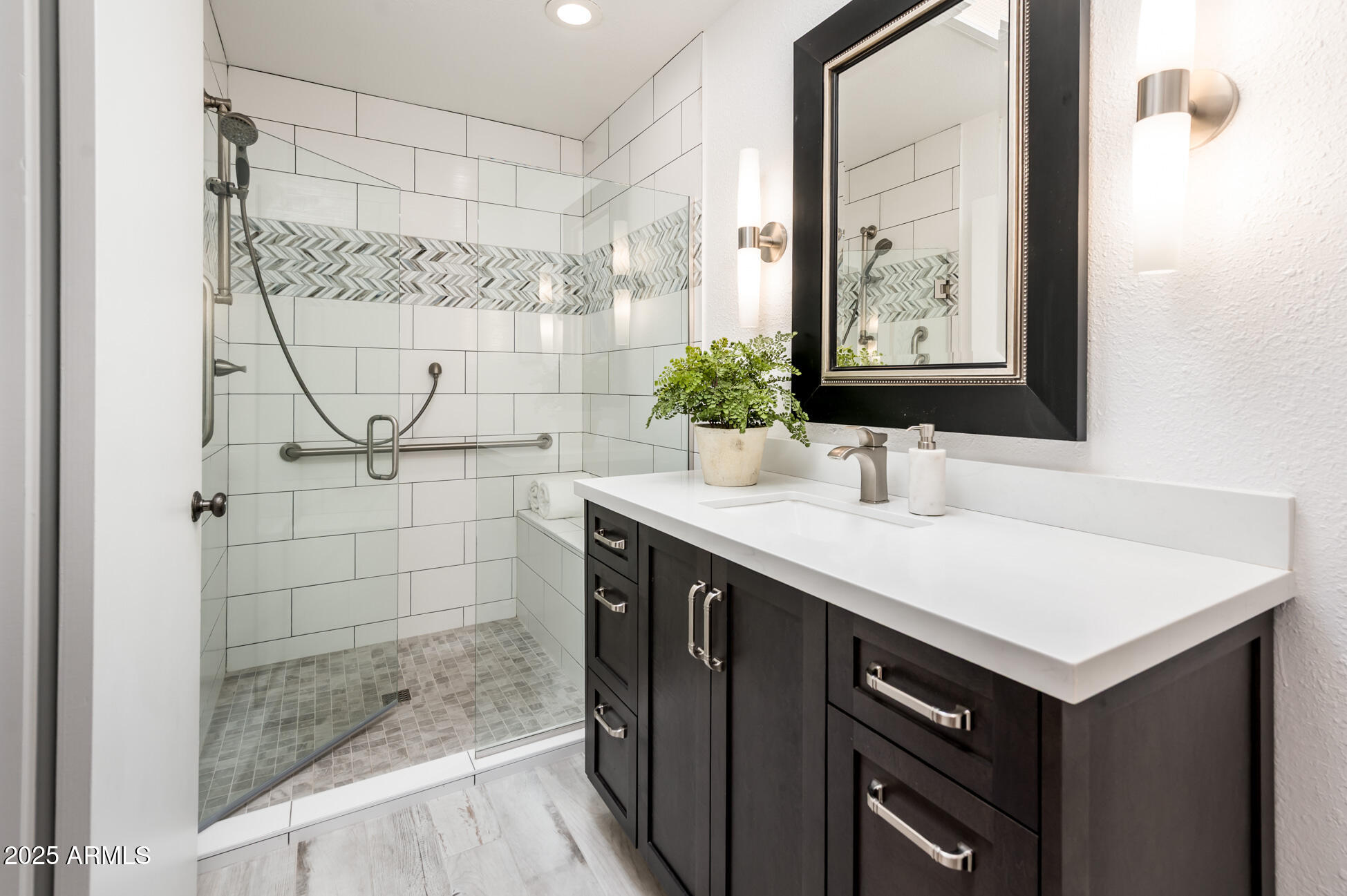 1224 East Rancho Drive Phoenix, AZ 85014 - Photo 28 of 38 a bathroom with a sink and a mirror
