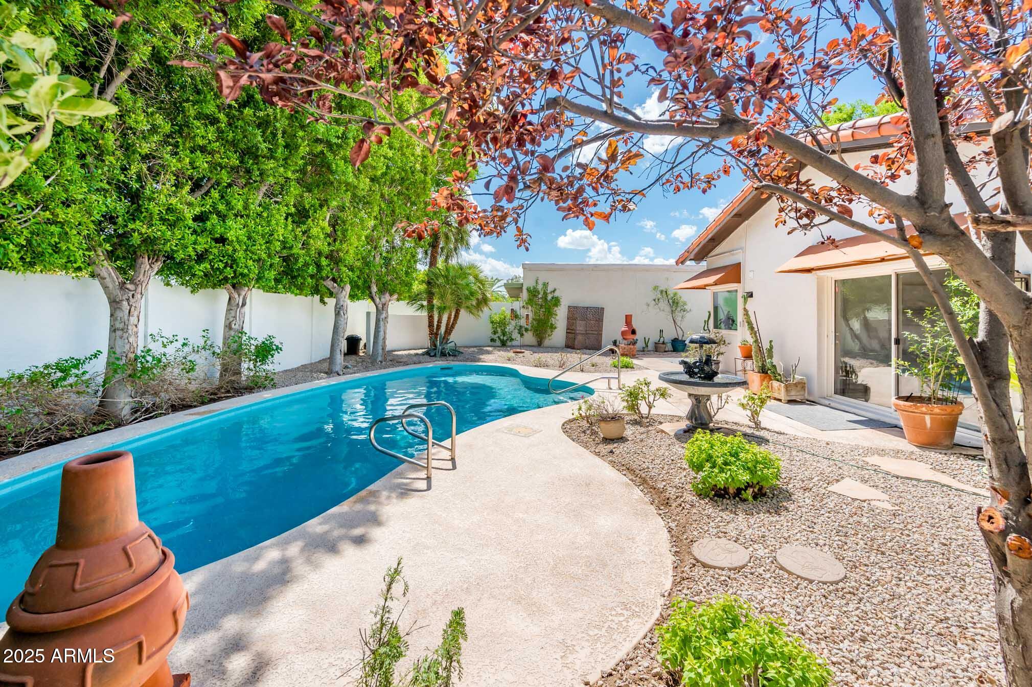 1224 East Rancho Drive Phoenix, AZ 85014 - Photo 36 of 38 a view of a backyard with plants and a patio