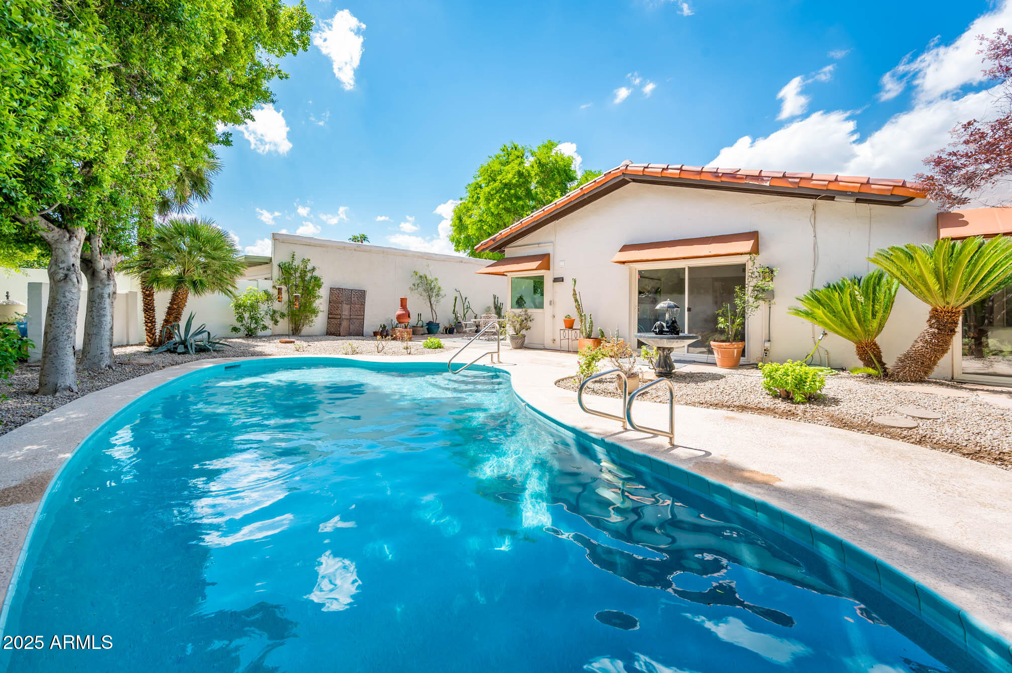1224 East Rancho Drive Phoenix, AZ 85014 - Photo 5 of 38 a backyard of a house with table and chairs